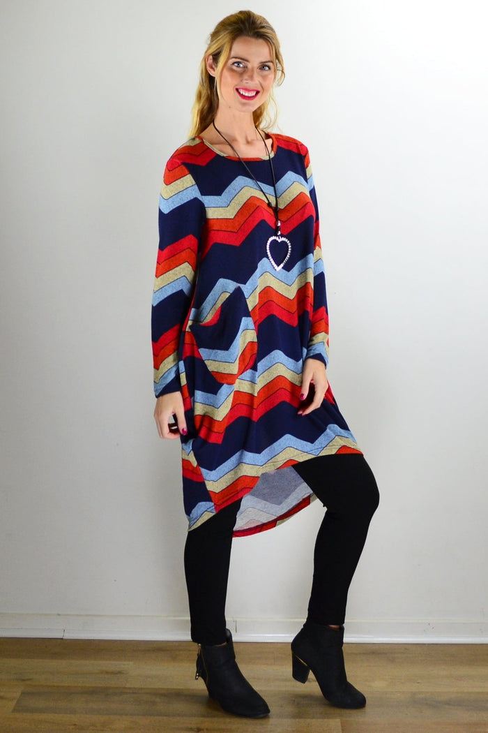 Hourglass Candy Lane Wool Knit Tunic Top, cream-colored with a cozy knit texture, displayed on a hanger.