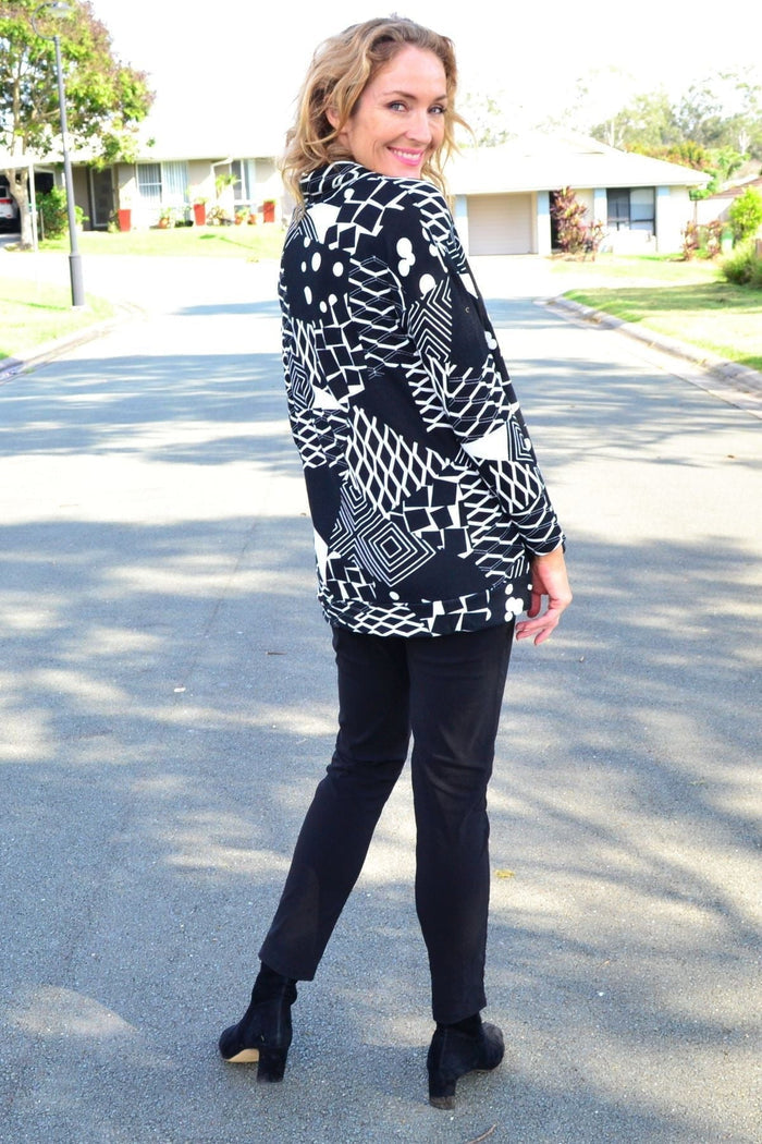 Wishstone Dotty Do Little long sleeve fleece tunic top featuring a cozy, dotted pattern and relaxed fit for casual wear.