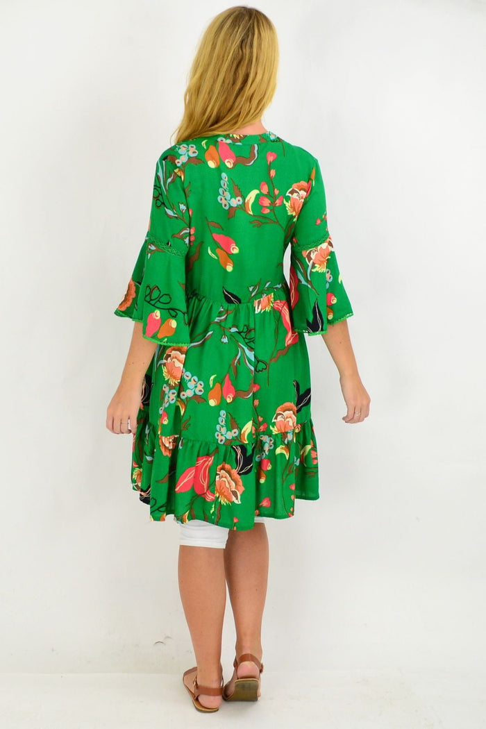 Tropical green Betty Bell Sleeve Tunic Dress by Willow Tree, featuring bell sleeves and a relaxed fit, shown on a model.