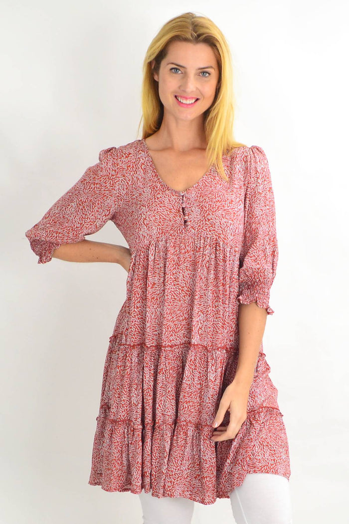 Red smocking sleeve tiered tunic dress by Silver Wishes, featuring a stylish design with tiered layers and bold spots.
