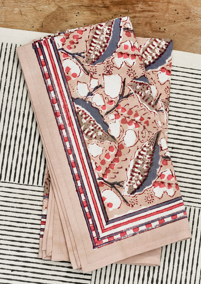 A pair of block printed napkins on a table.