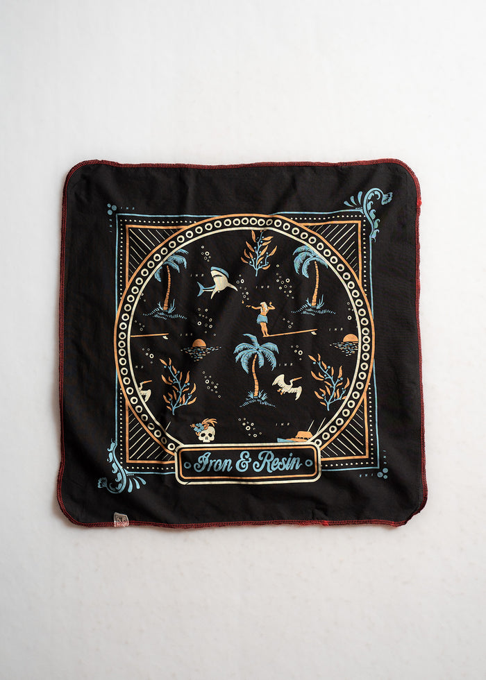 A black bandana with tropical and nautical motifs, featuring palm trees and sharks, branded with "Iron & Resin" in the center.