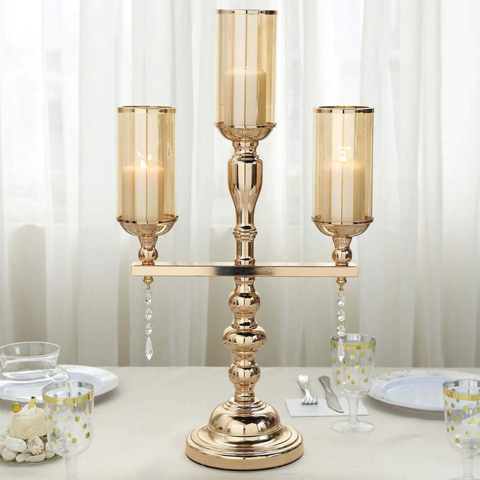 Elegant three-arm candle holder with glass shades and crystal accents.
