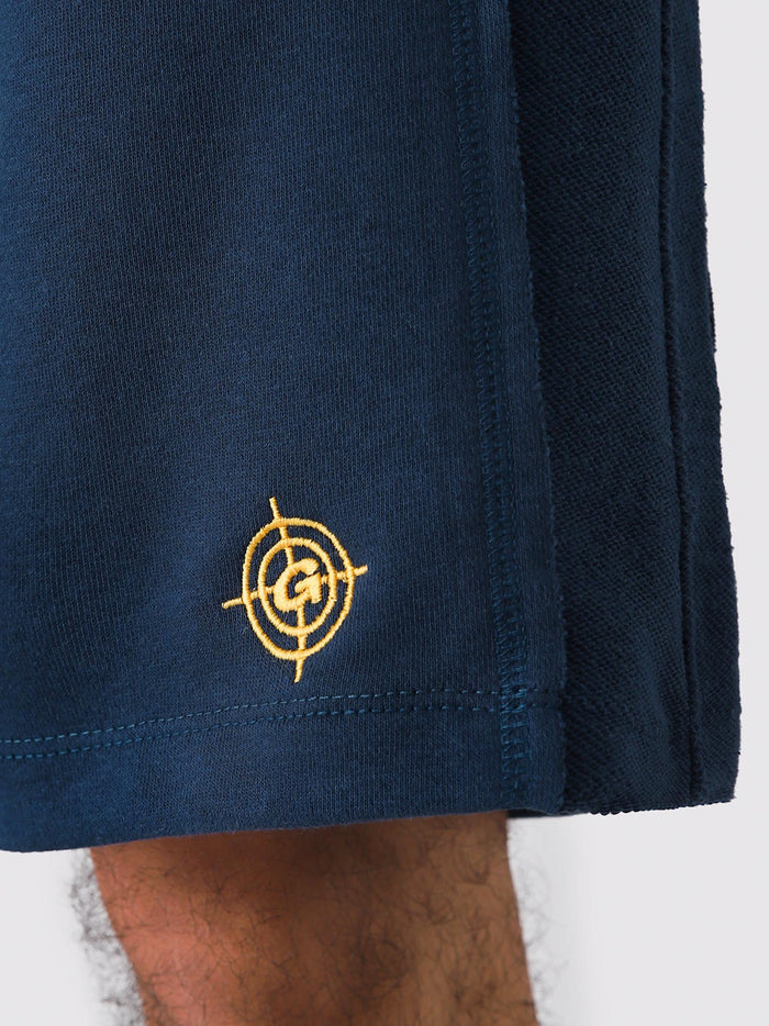 Deep Blue Aim Shorts on model, relaxed-fit men's gym and casual shorts by GROOVY Pakistan
