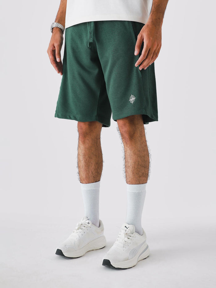 Man wearing Deep Green Aim Shorts, GROOVY men's sport and lounge shorts, Pakistan streetwear