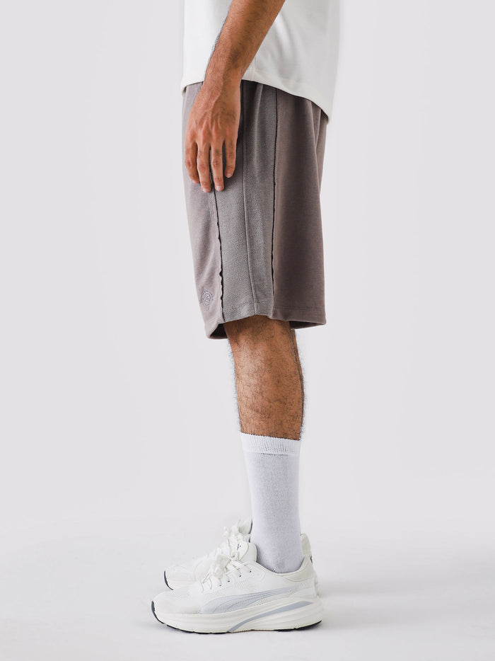 Man wearing Stone Mauve Aim Shorts, GROOVY men's sport and lounge shorts, Pakistan streetwear