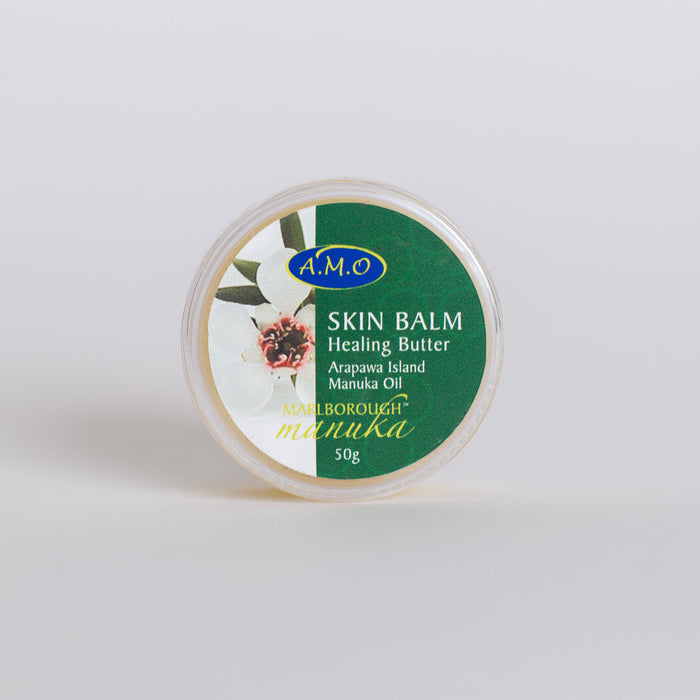 50g Pot of skin balm. Green and white label with Manuka flower on it.
