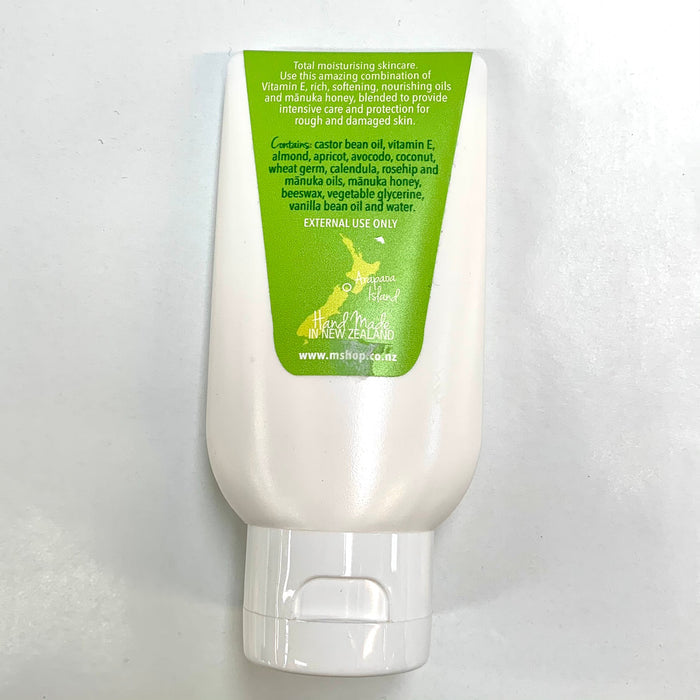 Back of 100ml cream bottle. Green label with ingredients list and instructions.