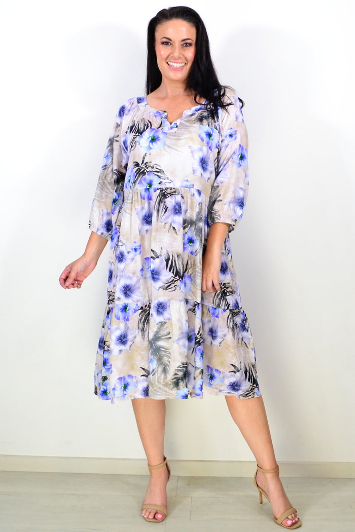 Beige and blue floral midi tunic dress by Hourglass, featuring a flowy fabric and elegant floral pattern.