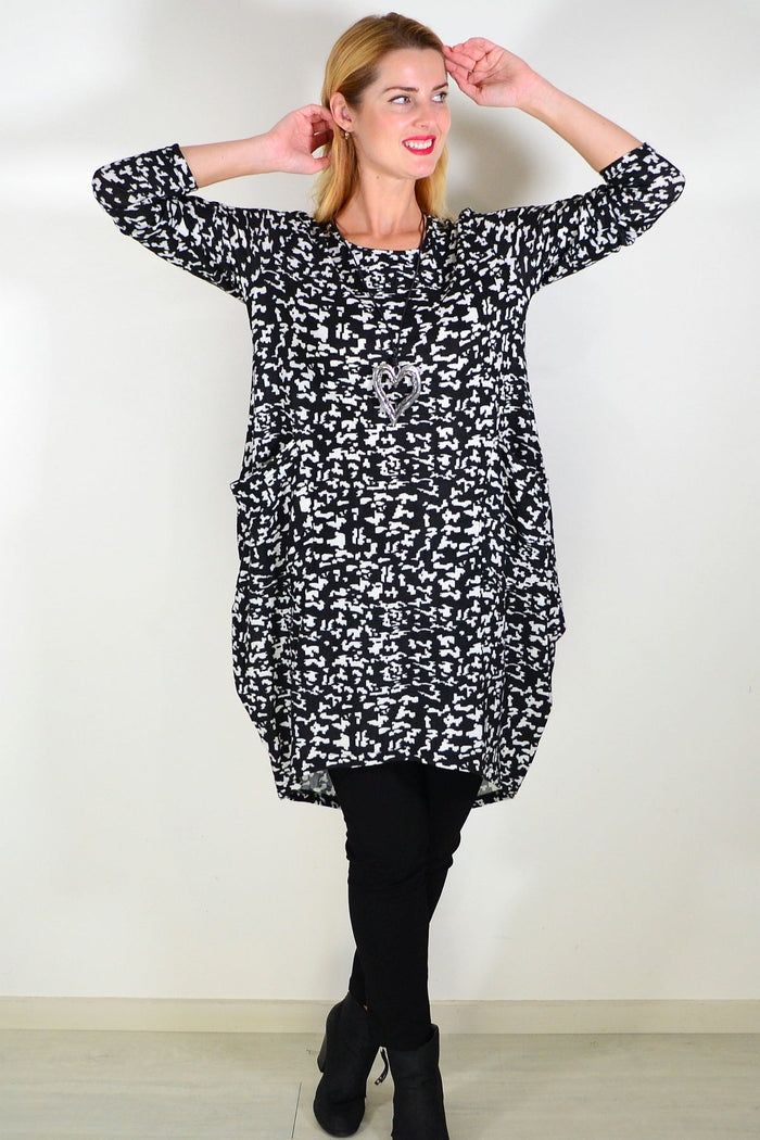 Black Digitech knit tunic top by I Love Tunics, featuring a relaxed fit and textured fabric, displayed on a hanger.