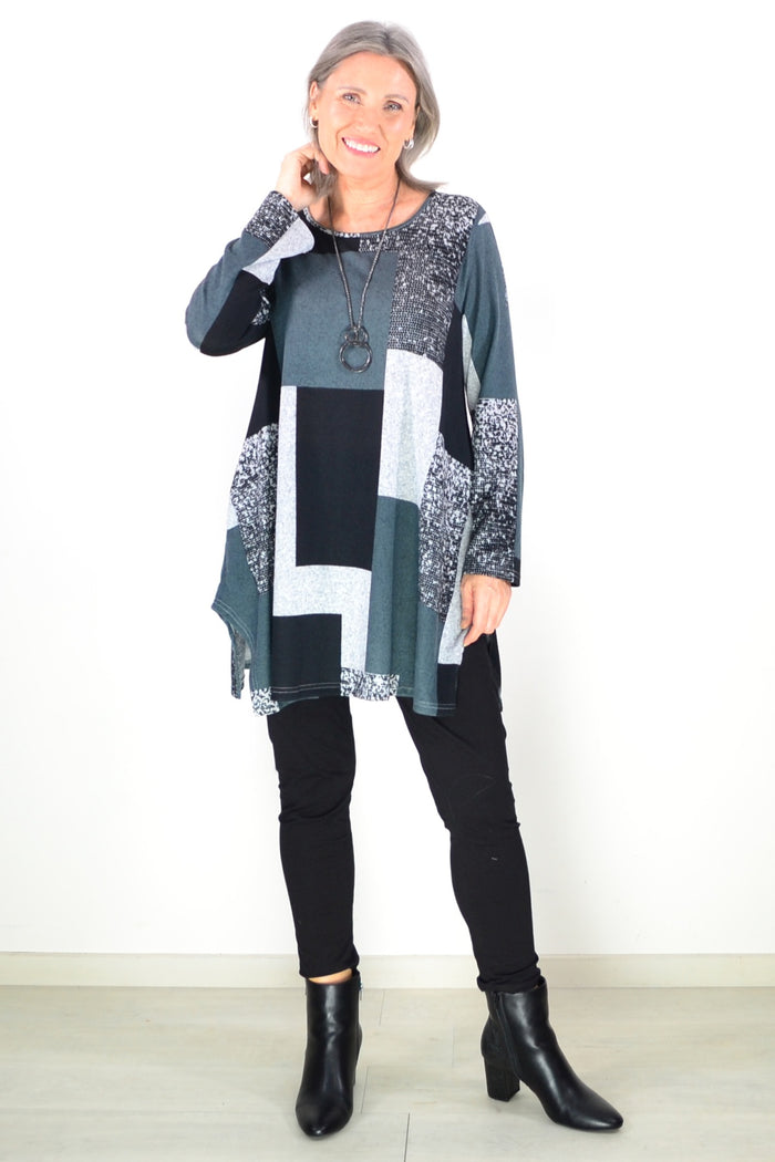 Black and grey geometric fleece tunic top by Hourglass, featuring a comfortable relaxed fit and stylish design.