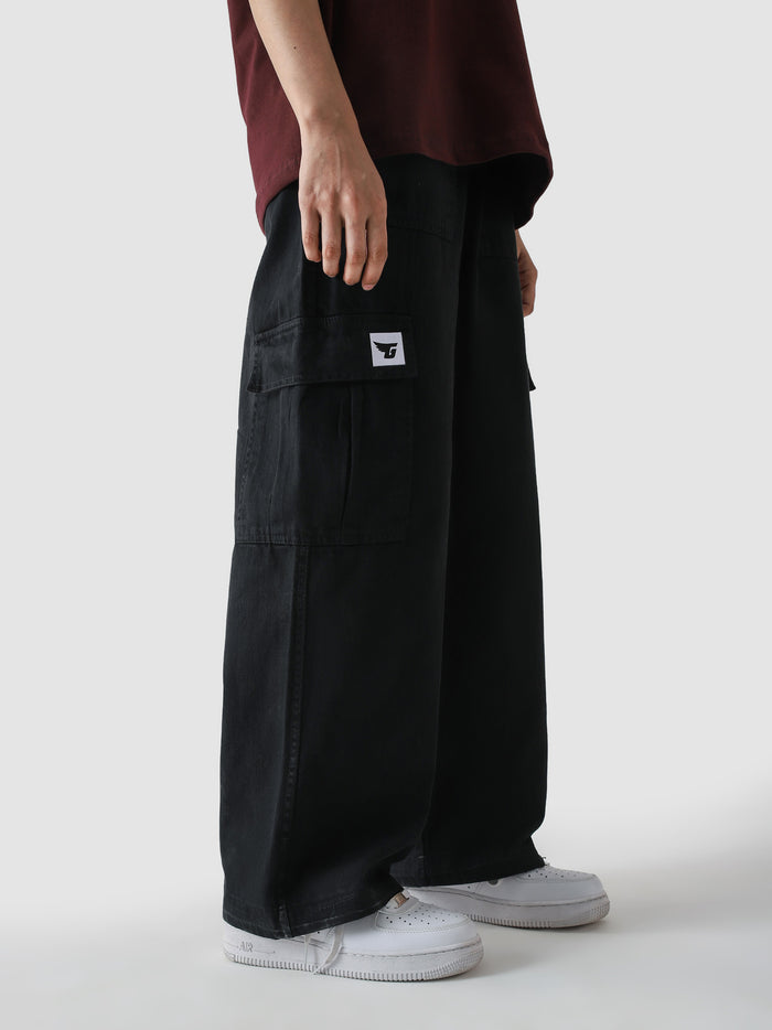 Black VII Cargo pants male model full body front view streetwear – GROOVY Pakistan