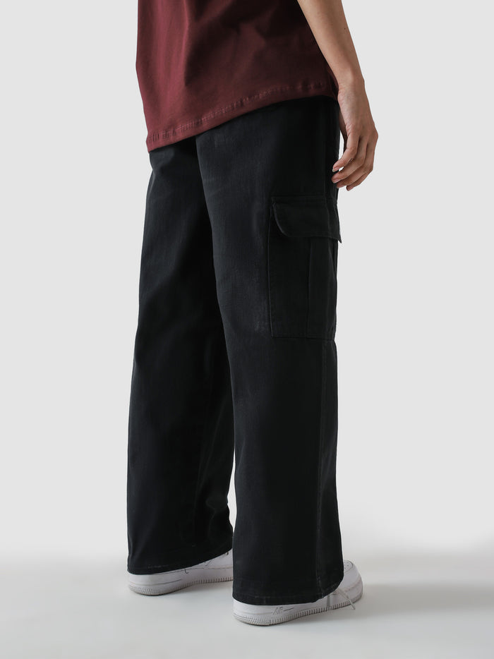 Black VII Cargo pants male model side view full body – GROOVY Pakistan