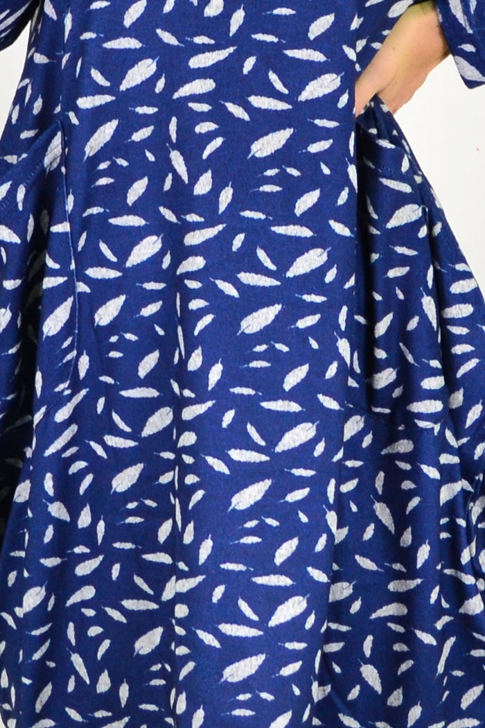 Blue floating leaf knit tunic top from I Love Tunics, featuring a relaxed fit and leaf pattern, displayed on a hanger.
