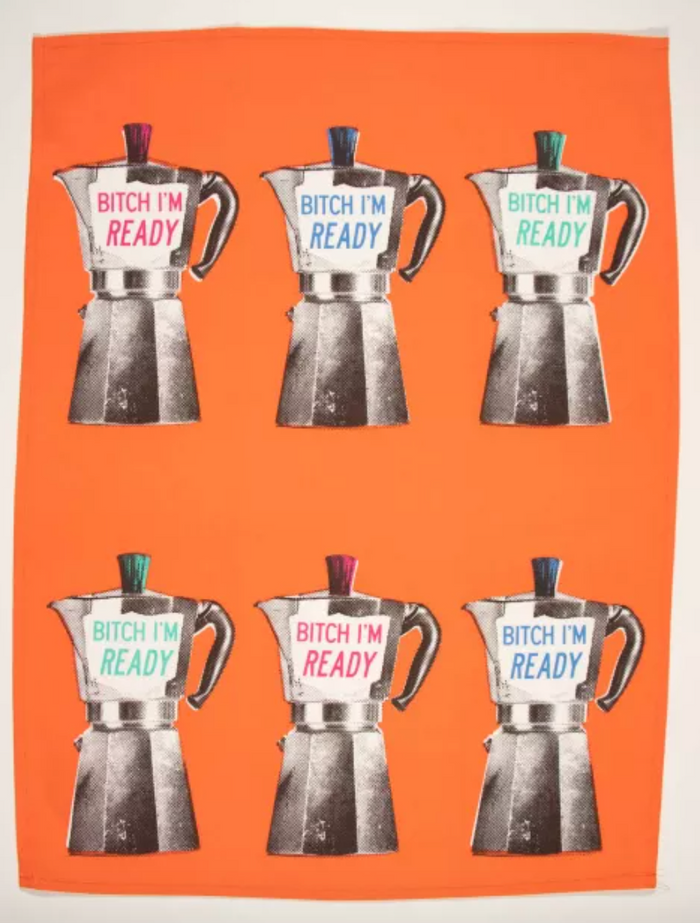 The full Blue Q towel unfolded. Bright orange with 6 screen-printed Moka Pots in two rows of 3 each. Each pot has a different accent color on the lid and writing (red, blue and green), which reads "Bitch I'm ready"