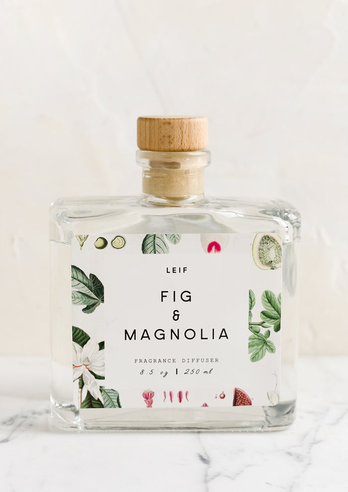 A fig and magnolia scented reed diffuser with glass bottle.
