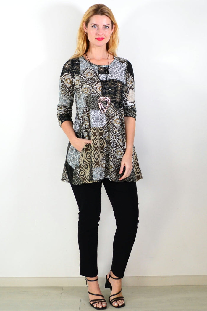 Brown abstract print fleece tunic top by Hourglass Avalon, featuring a cozy, stylish design with a relaxed fit and soft fabric.