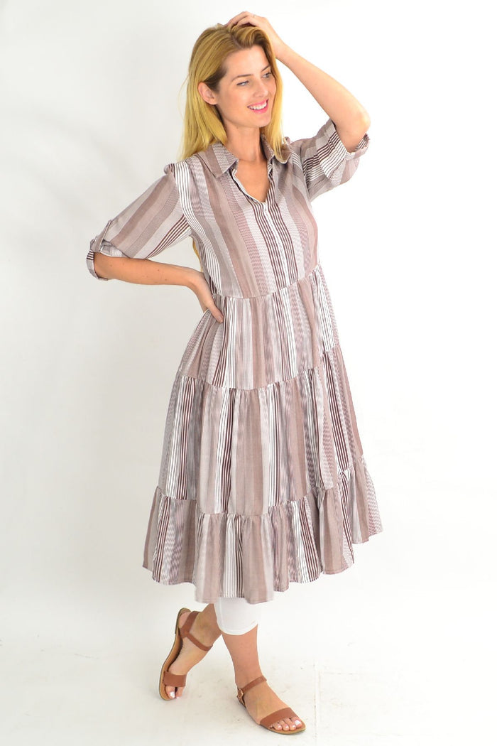 Brown Willow Tree classic strip collar tunic dress hanging on a hanger with a collared neckline and long sleeves.