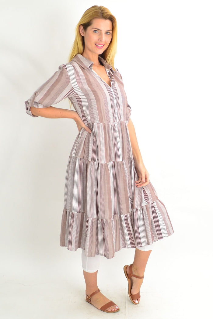 Brown Willow Tree classic strip collar tunic dress with long sleeves and relaxed fit, worn by a model in a casual setting.