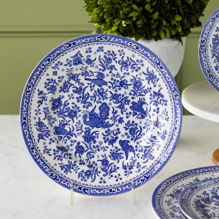 Burleigh Blue Regal Peacock Dinner Plate on a stand.