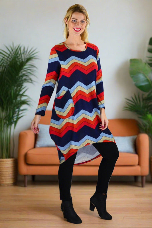 Hourglass Candy Lane wool knit tunic top with long sleeves and cozy texture, displayed on a hanger.