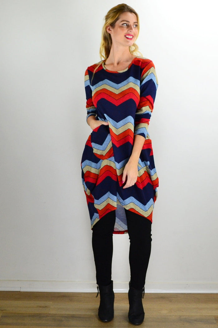 Hourglass Candy Lane wool knit tunic top with long sleeves and cozy texture, displayed on a hanger.