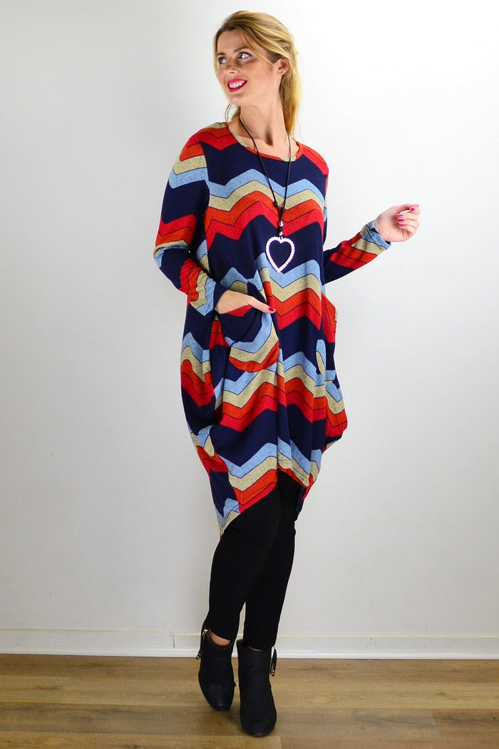 Hourglass Candy Lane Wool Knit Tunic Top displayed on a hanger, featuring a cozy wool knit fabric and a relaxed fit.
