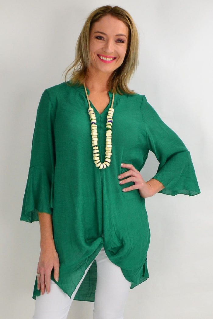 Green Wishstone tunic top with a relaxed fit, featuring a round neckline and long sleeves, perfect for casual wear.