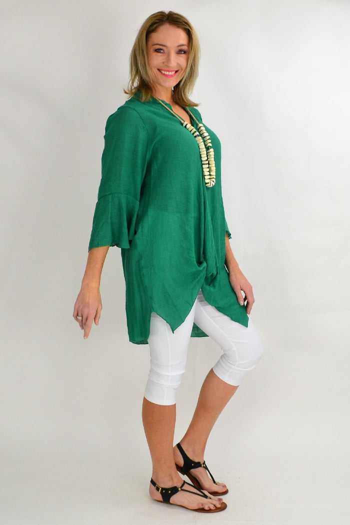 Wishstone green tunic top with long sleeves and a relaxed fit, styled on a mannequin.