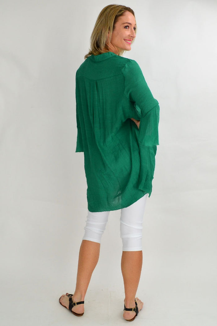 Green Wishstone tunic top with a relaxed fit and round neckline, styled as a casual, comfortable women's shirt.