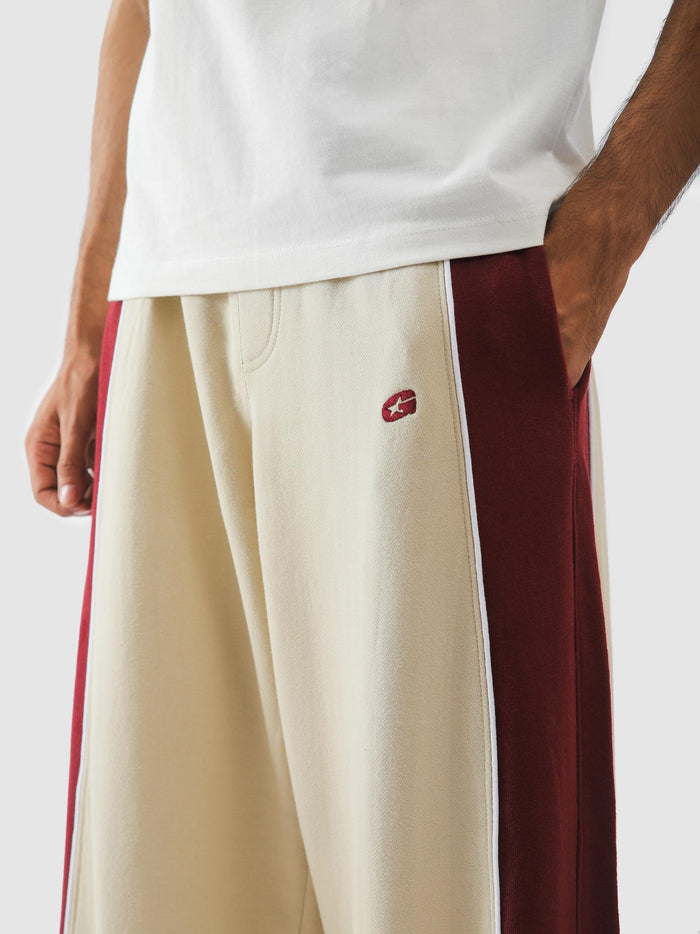 Embroidered logo at the hip on cream sweatpants - GROOVY Pakistan