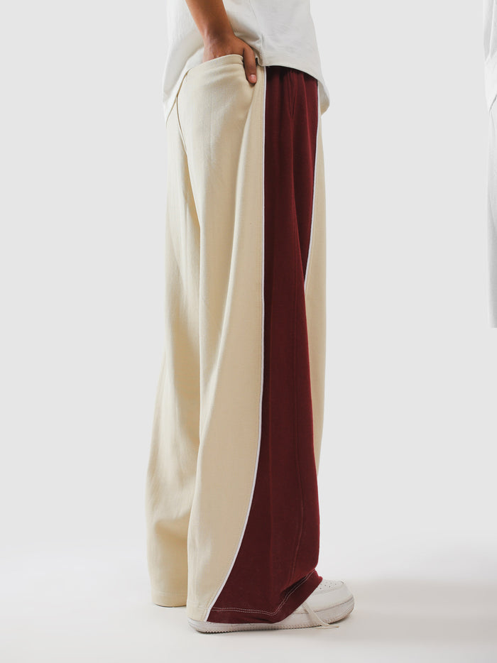 Cream and wine sweatpants styled with a white tee - GROOVY Pakistan