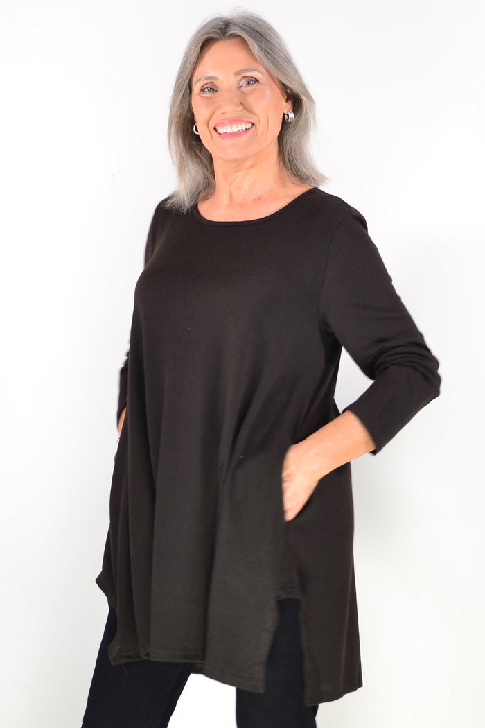 Dark brown fleece tunic top by Hourglass Avalon featuring a cozy winter design and relaxed fit, displayed on a hanger.
