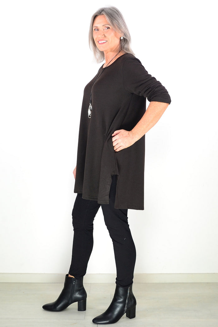 Dark brown fleece tunic top by Hourglass Avalon featuring a cozy winter design, shown on a hanger with a soft textured fabric.