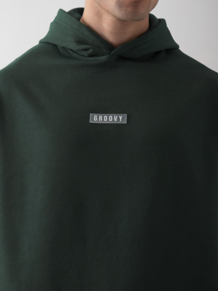 Dark green oversized hoodie female model back view relaxed fit Pakistan – GROOVY