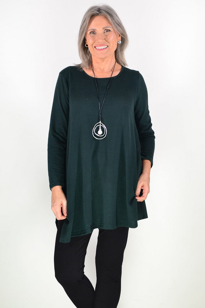 Dark green winter fleece tunic top by Hourglass Avalon, showing a cozy, long-sleeve design with a relaxed fit and textured fabric.