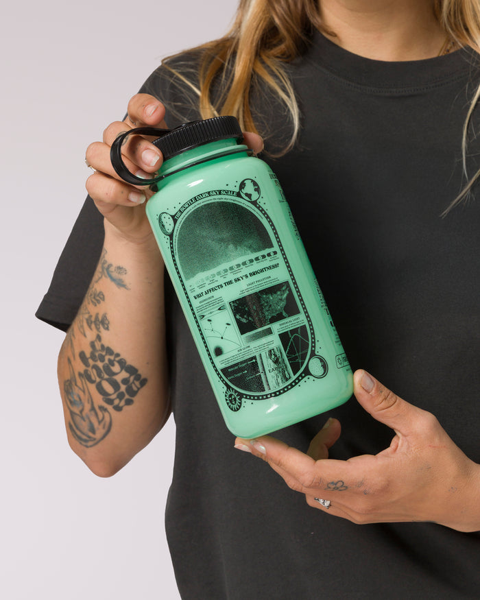 Shop Dark Sky Recycled Glow-In-The-Dark Water Bottle Inspired by Parks | green