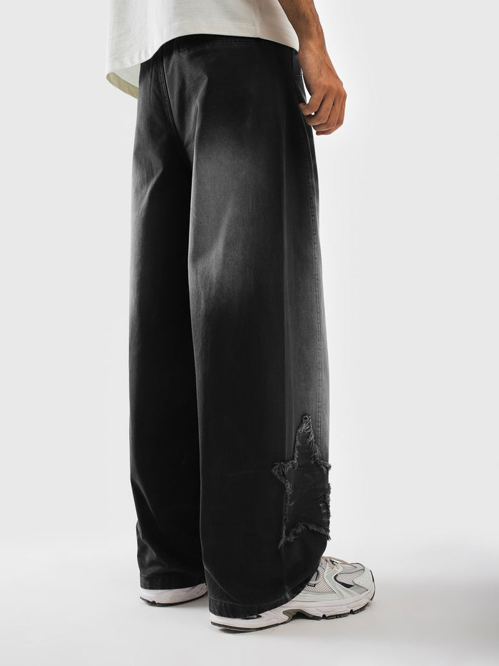 Side profile of baggy mineral washed trousers - GROOVY Pakistan