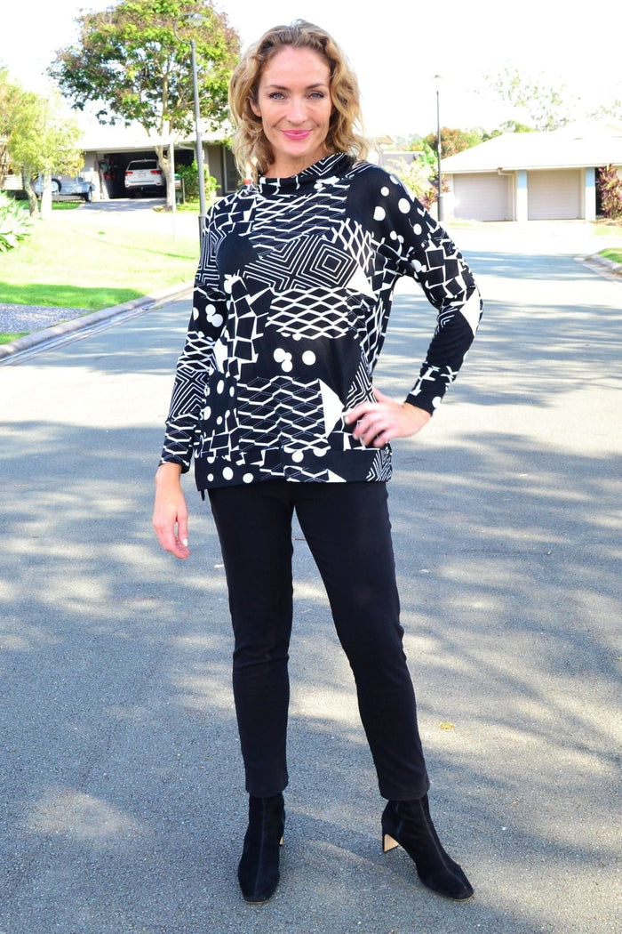 Wishstone Dotty Do Little long sleeve fleece tunic top with a cozy, dotted design and comfortable fit on a model.