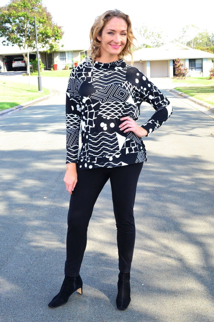 Wishstone Dotty Do Little long sleeve fleece tunic top with a cozy, patterned design, displayed on a hanger.