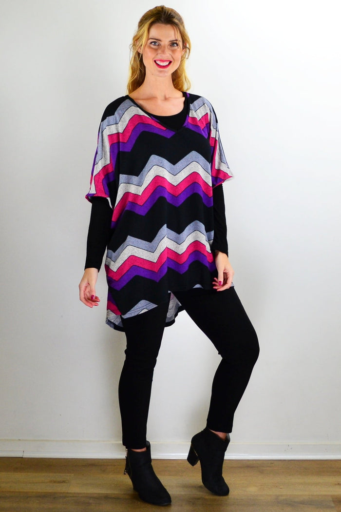 La Mode Fabulous Fleece Zig Zag knit tunic top with colorful pattern and cozy fabric, displayed on a hanger.