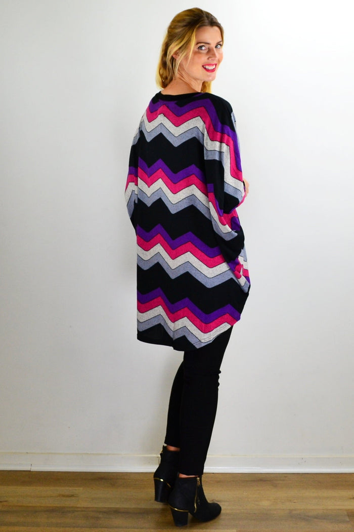 Fabulous Fleece Zig Zag knit tunic top by La Mode, featuring a colorful zig zag pattern and cozy fleece fabric.