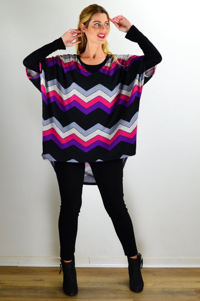 Fabulous Fleece Zig Zag knit tunic top by La Mode featuring a cozy fleece fabric and bold zig zag pattern, styled with long sleeves.