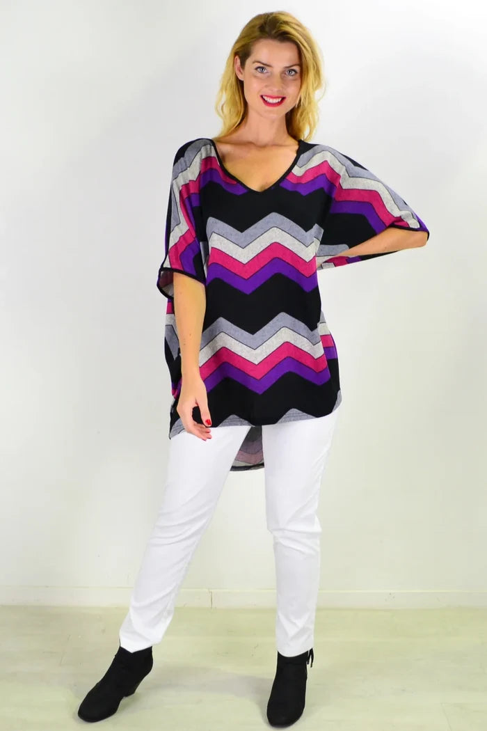 La Mode Fabulous Fleece Zig Zag knit tunic top with bold zig zag pattern, cozy fleece fabric, and relaxed fit.