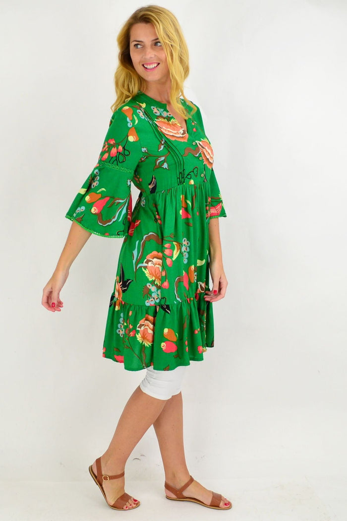 Green Betty bell sleeve tunic dress by Willow Tree, featuring bell sleeves and a relaxed fit, displayed on a mannequin.