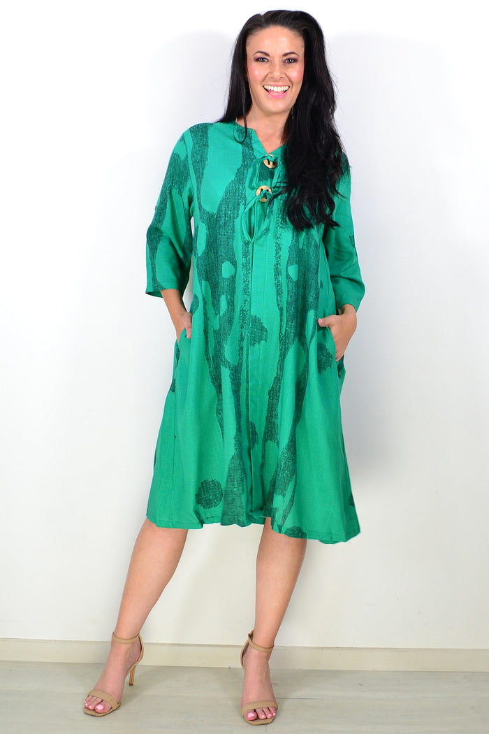 Green linen blend tunic dress by Ruby Rain, featuring a relaxed fit with long sleeves and a round neckline.