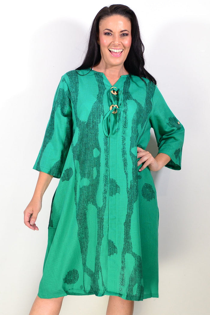 Green linen blend tunic dress by Ruby Rain, featuring a relaxed fit with long sleeves and a flowing silhouette.