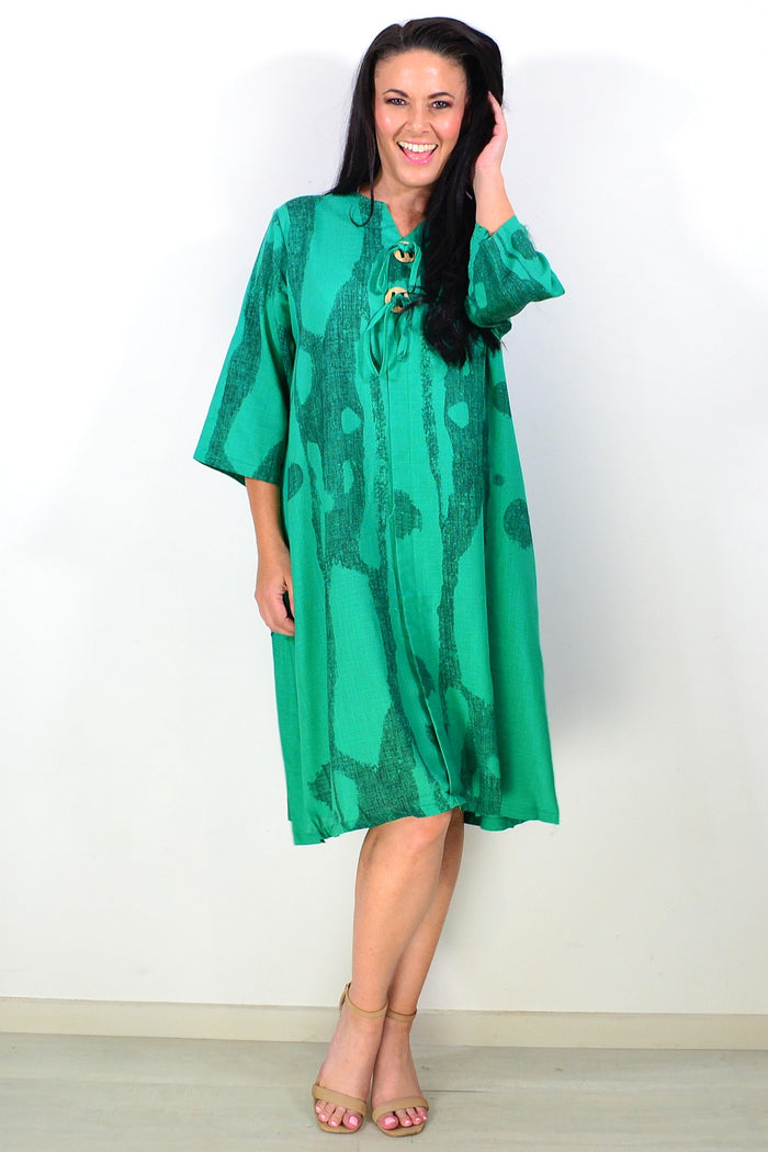 Green linen blend tunic dress by Ruby Rain, featuring a relaxed fit, long sleeves, and a casual, comfortable design.