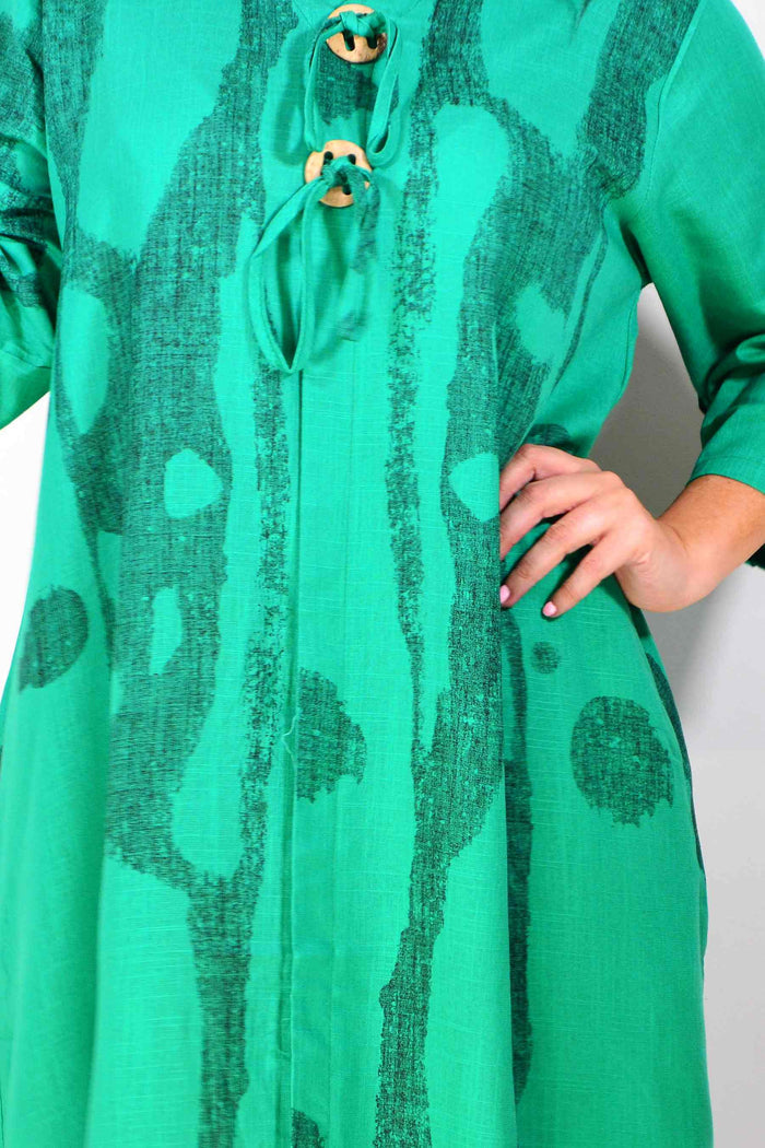 Green linen blend tunic dress by Ruby Rain, featuring a relaxed fit with long sleeves and a round neckline.