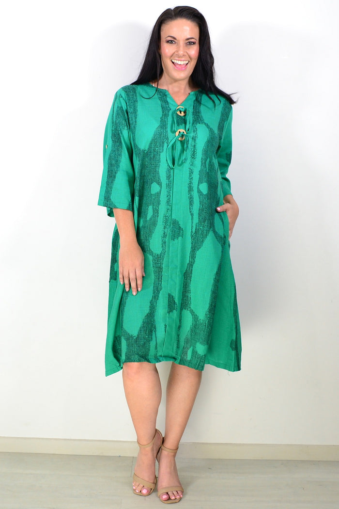 Green linen blend tunic dress by Ruby Rain, featuring a relaxed fit and natural fabric texture, perfect for casual wear.